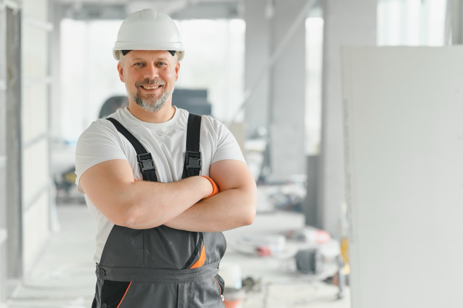Contractor in a hard hat standing on a California job site
